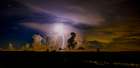 A distant thunder storm and sky draws contrast to the dark Big Cypress prairie. Art Print